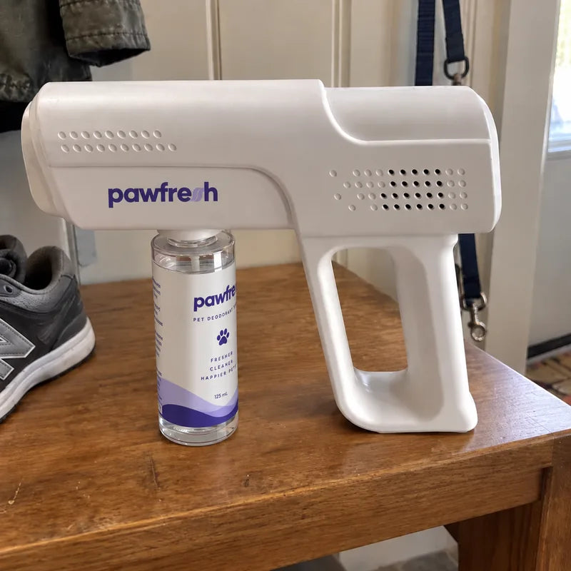 A PawFresh device and refill bottle on a hallway console table