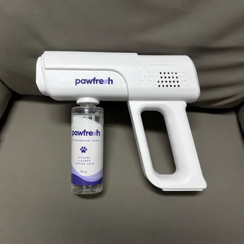 A PawFresh device and refill bottle beside a sofa
